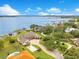 Luxury waterfront home with a basketball court, meticulously landscaped grounds, and a private dock at 10845 Bayshore Dr, Windermere, FL 34786