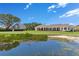 Lush lawn with lakeside gazebo, and manicured landscaping at 10845 Bayshore Dr, Windermere, FL 34786