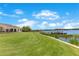 Beautifully maintained lawn with a private dock and gazebo on the lake at 10845 Bayshore Dr, Windermere, FL 34786