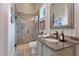 Charming bathroom featuring a glass shower and unique vanity at 10845 Bayshore Dr, Windermere, FL 34786
