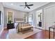 Cozy bedroom with neutral tones, a wrought iron bed, and ensuite bathroom at 10845 Bayshore Dr, Windermere, FL 34786