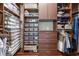 Organized walk-in closet featuring custom shelving, drawers, and hanging space for clothes and shoes at 10845 Bayshore Dr, Windermere, FL 34786