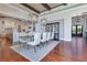 Dining room featuring beamed ceilings, stylish lighting, and access to the front entry at 10845 Bayshore Dr, Windermere, FL 34786