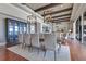 Open-concept dining room with beamed ceilings connects to the living room and offers ample space at 10845 Bayshore Dr, Windermere, FL 34786
