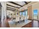Elegant dining area with water views and seamless flow to the living room and outdoors at 10845 Bayshore Dr, Windermere, FL 34786