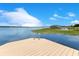 Wooden dock with a swim ladder offers easy access to the lake, perfect for swimming and water activities at 10845 Bayshore Dr, Windermere, FL 34786