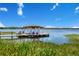 Private dock featuring a gazebo, providing direct access to the lake at 10845 Bayshore Dr, Windermere, FL 34786
