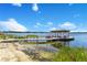 Private dock with gazebo, offering picturesque views of the lake at 10845 Bayshore Dr, Windermere, FL 34786