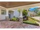 Inviting home entrance with a stone and brick column porch and manicured landscaping at 10845 Bayshore Dr, Windermere, FL 34786
