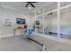 Spacious home gym with mirrored wall, rowing machine, and natural light at 10845 Bayshore Dr, Windermere, FL 34786