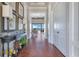 Inviting hallway with herringbone floors and a view of the lake beyond at 10845 Bayshore Dr, Windermere, FL 34786