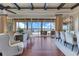 Spacious living and dining area with hardwood floors and expansive lake views at 10845 Bayshore Dr, Windermere, FL 34786