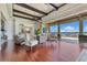 Inviting living room with seamless access to an outdoor pool and waterfront view at 10845 Bayshore Dr, Windermere, FL 34786