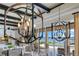 Open living space featuring designer lighting and expansive views of the water at 10845 Bayshore Dr, Windermere, FL 34786