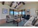 Bright living room with wood floors, ceiling fan, and an amazing water view at 10845 Bayshore Dr, Windermere, FL 34786