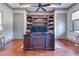 Expansive office with custom built-ins and large desk, providing ample storage and workspace at 10845 Bayshore Dr, Windermere, FL 34786