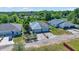 Aerial view showcasing the home's curb appeal and spacious driveway at 1115 S Mary St, Eustis, FL 32726