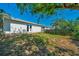 Backyard with patio, white siding, and a privacy fence at 1115 S Mary St, Eustis, FL 32726