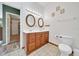 Clean bathroom featuring a double vanity and tile floors at 1115 S Mary St, Eustis, FL 32726