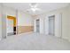 Spacious bedroom with neutral carpet, ceiling fan, and closet space at 1115 S Mary St, Eustis, FL 32726