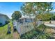 Landscaped front yard with a white picket fence, offering a quaint and inviting appeal at 1115 S Mary St, Eustis, FL 32726