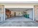 Large garage space with laundry, shelving, and work area at 1115 S Mary St, Eustis, FL 32726
