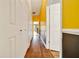 Bright hallway with wood floors and a view to the entry at 1115 S Mary St, Eustis, FL 32726