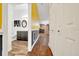Hallway view to the bathroom, living area, and a wall with yellow paint at 1115 S Mary St, Eustis, FL 32726