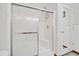 White shower with clear glass doors and tile flooring at 1115 S Mary St, Eustis, FL 32726