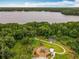 Expansive aerial view featuring a playground, picnic area, and a tranquil lake, surrounded by beautiful scenery at 1147 Wildmeadow Run, Winter Park, FL 32792