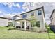 Home exterior with manicured lawn, covered patio perfect for outdoor gatherings and relaxation at 1147 Wildmeadow Run, Winter Park, FL 32792
