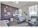 bedroom with space themed wallpaper, a window, modern blinds, a bed, and carpet flooring at 1147 Wildmeadow Run, Winter Park, FL 32792
