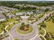Aerial view of the community featuring a pool, clubhouse, pond, and well-manicured landscaping at 1147 Wildmeadow Run, Winter Park, FL 32792