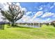 Beautiful community pond with a fountain, surrounded by lush green lawns and well-maintained landscaping at 1147 Wildmeadow Run, Winter Park, FL 32792