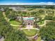 Aerial view of the community pool, clubhouse, and well-maintained landscaping at 11868 Thatcher Ave, Orlando, FL 32836