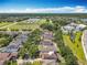 Aerial view of neighborhood homes, pond, and community green space at 11868 Thatcher Ave, Orlando, FL 32836