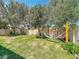 Spacious backyard featuring lush green grass, mature trees, and a relaxing hammock at 11868 Thatcher Ave, Orlando, FL 32836