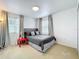 Bedroom with carpet, natural light and neutral colored walls at 11868 Thatcher Ave, Orlando, FL 32836
