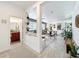 View of the open-concept living spaces, with a bathroom, dining area, and plants at 11868 Thatcher Ave, Orlando, FL 32836