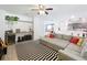 Living room featuring a large sectional sofa and desk space with a wine refrigerator at 11868 Thatcher Ave, Orlando, FL 32836