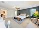 Large primary bedroom features neutral carpet and an accent wall at 11868 Thatcher Ave, Orlando, FL 32836