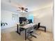 Neutral colored home office features a fan and plenty of natural light at 11868 Thatcher Ave, Orlando, FL 32836