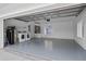 Spacious garage with epoxy floors, laundry hookups, and ample storage space at 12508 Lake Denise Blvd, Clermont, FL 34711