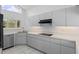Modern kitchen featuring sleek countertops, ample cabinetry, stainless steel appliances, and a bright, airy atmosphere at 12508 Lake Denise Blvd, Clermont, FL 34711