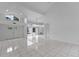Spacious living room with tile flooring, neutral walls, and large windows that flood the room with natural light at 12508 Lake Denise Blvd, Clermont, FL 34711