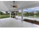 Inviting screened patio with a view of the refreshing pool and lake at 12508 Lake Denise Blvd, Clermont, FL 34711
