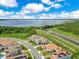 Gorgeous aerial view showcasing the community's proximity to a large lake and nature preserve at 13791 Abberwick Dr, Orlando, FL 32832
