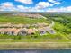 Community aerial showcasing well-manicured lawns, pools, and beautiful tile roofs at 13791 Abberwick Dr, Orlando, FL 32832
