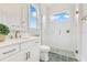 Modern bathroom featuring a glass enclosed shower, quartz countertops, and stylish fixtures at 13791 Abberwick Dr, Orlando, FL 32832