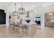 Spacious kitchen with a center island, white cabinetry, and modern stainless steel appliances at 13791 Abberwick Dr, Orlando, FL 32832